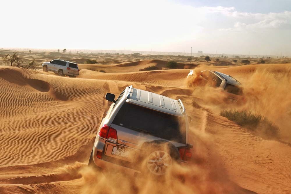 Desert Safari Ras Al Khaimah - The afternoon desert safari in Ras Al Khaimah is one of the musts to do activities. It is one of the best ways to enjoy the charm and beauty of the golden dunes of Arabia by an off-road vehicle. Take optional camel rides, get a henna tattoo on you. Desert Safari Ras Al Khaimah - Image 1 of 5