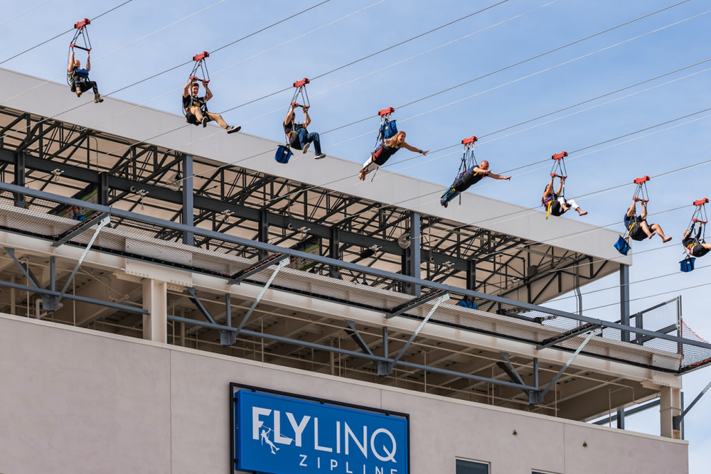 FlyLINQ Zipline Las Vegas - Experience the thrill of FlyLINQ Zipline in Las Vegas and soar 114 feet above the Strip. Enjoy fast-track access to skip the long lines and get a unique view of the bustling streets below. Perfect for thrill-seekers, families, and friends, this zipline ride offers an unforgettable adventure day or night. FlyLINQ Zipline Las Vegas - Image 1 of 5