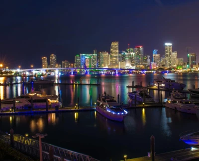 Miami Open-Top Night Bus Tour - Explore Miami’s vibrant nightlife on a 90-minute open-top night bus tour. Ride through Downtown, Brickell, and South Beach, admiring illuminated skyscrapers and iconic landmarks. Enjoy breathtaking skyline views from the Key Biscayne Bridge and feel the Miami breeze as you pass palm-lined streets. Expert guides provide engaging commentary, sharing fascinating insights into the city’s history and culture. A perfect way to experience the magic of Miami after dark. Miami Open-Top Night Bus Tour - Image 5 of 5