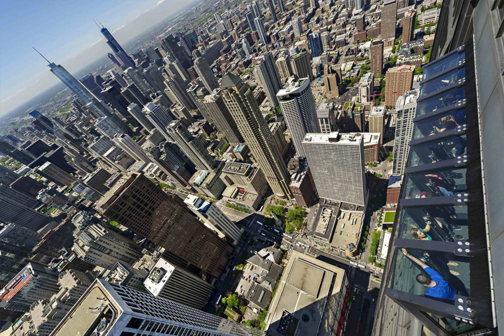 360 Chicago Observation Deck Ticket - Experience breathtaking views of Chicago from the 360 Chicago Observation Deck. Enjoy panoramic city views, interactive exhibits, and the thrilling TILT experience. Enhance your visit with the Magnicity App and relax at the Cloud Bar with local drinks. 360 Chicago Observation Deck Ticket - Image 1 of 5