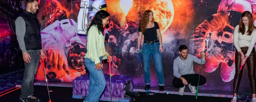 Blacklight Mini Golf at American Dream - Experience the glow-in-the-dark fun of Blacklight Mini Golf at American Dream! Challenge yourself on an exciting 18-hole course with unique obstacles and vibrant neon artwork. Capture memorable moments in this immersive and interactive mini golf adventure. Book your Blacklight Mini Golf ticket now for an unforgettable experience! Blacklight Mini Golf at American Dream - Image 4 of 5