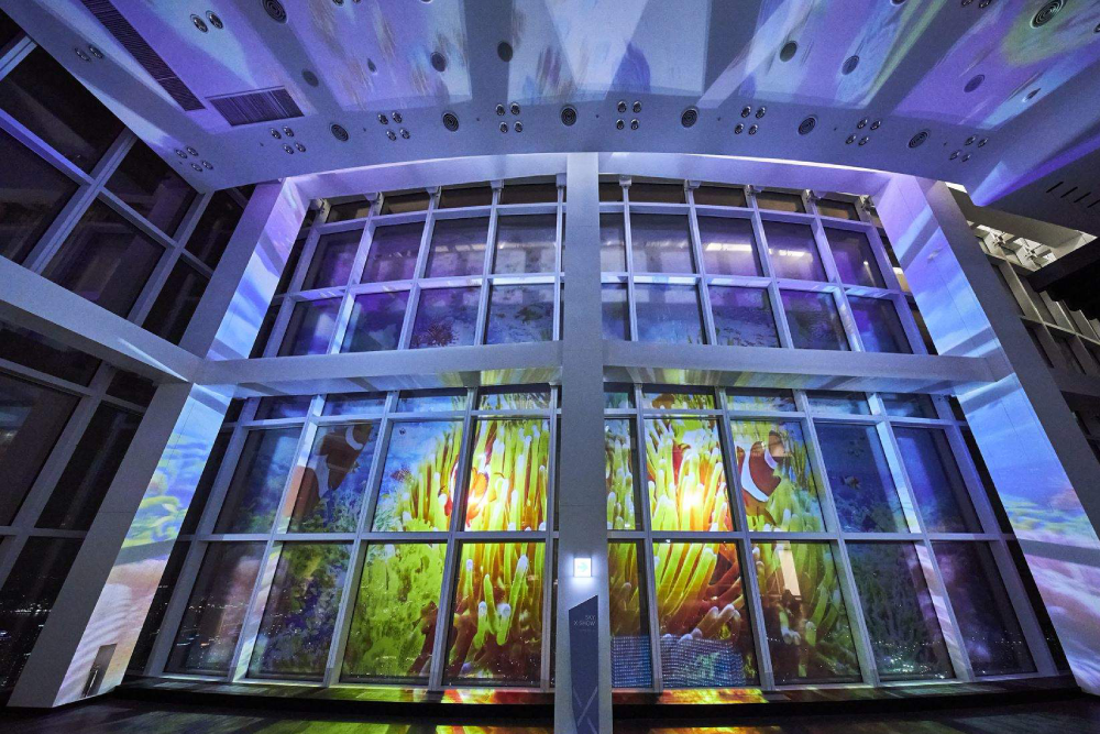 Busan X the Sky - Busan X the Sky offers breathtaking views from the second tallest building in Korea, the Haeundae L City Landmark Tower. At Busan X the Sky, enjoy stunning ocean and city views of Busan from the top. This isn’t just an observatory – Busan X the Sky also features exciting shows, videos, and restaurants for a complete experience. Visit Busan X the Sky for a perfect outing with beautiful sights and entertainment. Whether for a date or a family trip, Busan X the Sky has something for everyone. Busan X the Sky - Image 4 of 5