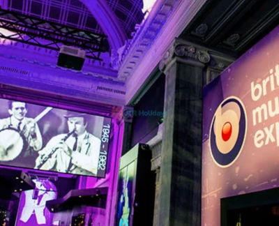 British Music Experience - Discover the British Music Experience in Liverpool, the ultimate museum for music lovers. Explore the history of British music through costumes, instruments, and over 600 memorabilia pieces. At the British Music Experience, see outfits worn by legends like Freddie Mercury and the Spice Girls. Try playing instruments at the Gibson Interactive Studio inside the British Music Experience. Watch holographic performances and relive iconic moments at the British Music Experience. A must-visit for fans of British music and pop culture! British Music Experience - Image 2 of 5