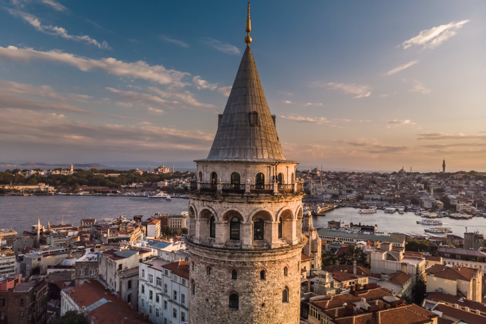 Galata Tower Istanbul - Discover the beauty of Galata Tower Istanbul, a historic landmark offering breathtaking city views. Climb to the top of Galata Tower Istanbul and enjoy a 360-degree panorama of the skyline and Bosphorus. Built in 1300, Galata Tower Istanbul showcases a unique blend of Byzantine, Genoese, and Ottoman architecture. Explore the rich history of Galata Tower Istanbul while experiencing its modern charm. Don't miss the chance to visit Galata Tower Istanbul, one of the city's most iconic attractions! Galata Tower Istanbul - Image 1 of 5