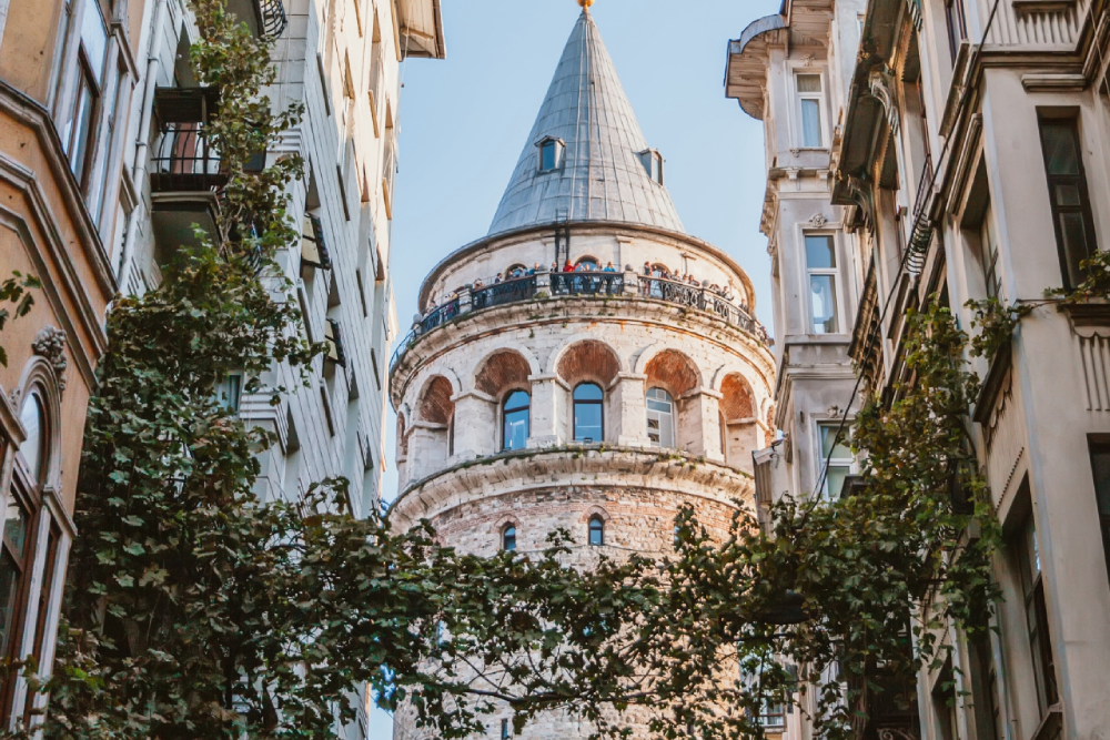 Galata Tower Istanbul - Discover the beauty of Galata Tower Istanbul, a historic landmark offering breathtaking city views. Climb to the top of Galata Tower Istanbul and enjoy a 360-degree panorama of the skyline and Bosphorus. Built in 1300, Galata Tower Istanbul showcases a unique blend of Byzantine, Genoese, and Ottoman architecture. Explore the rich history of Galata Tower Istanbul while experiencing its modern charm. Don't miss the chance to visit Galata Tower Istanbul, one of the city's most iconic attractions! Galata Tower Istanbul - Image 2 of 5