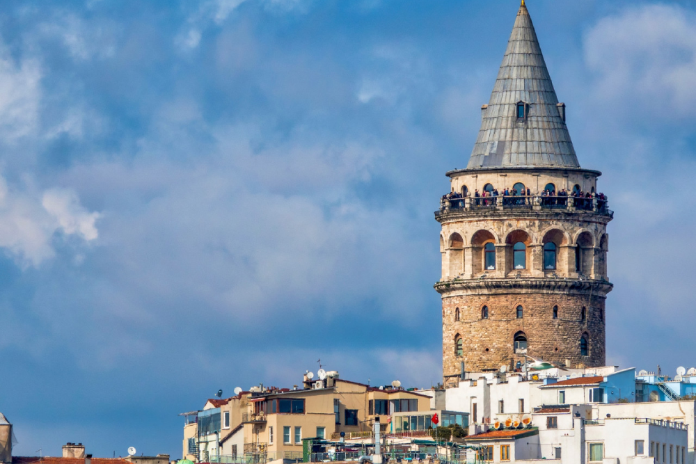 Galata Tower Istanbul - Discover the beauty of Galata Tower Istanbul, a historic landmark offering breathtaking city views. Climb to the top of Galata Tower Istanbul and enjoy a 360-degree panorama of the skyline and Bosphorus. Built in 1300, Galata Tower Istanbul showcases a unique blend of Byzantine, Genoese, and Ottoman architecture. Explore the rich history of Galata Tower Istanbul while experiencing its modern charm. Don't miss the chance to visit Galata Tower Istanbul, one of the city's most iconic attractions! Galata Tower Istanbul - Image 5 of 5