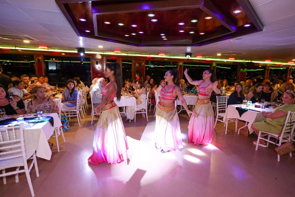 Bosphorus Dinner Cruise with Turkish Night Show Istanbul - Sail along the Bosphorus Strait on a magical dinner cruise in Istanbul. Enjoy breathtaking views of iconic landmarks while savoring a delicious Turkish meal. Experience live entertainment with belly dancers, folk music, and a DJ performance. Book now for an unforgettable Turkish Night Show on the Bosphorus! Bosphorus Dinner Cruise with Turkish Night Show Istanbul - Image 4 of 5