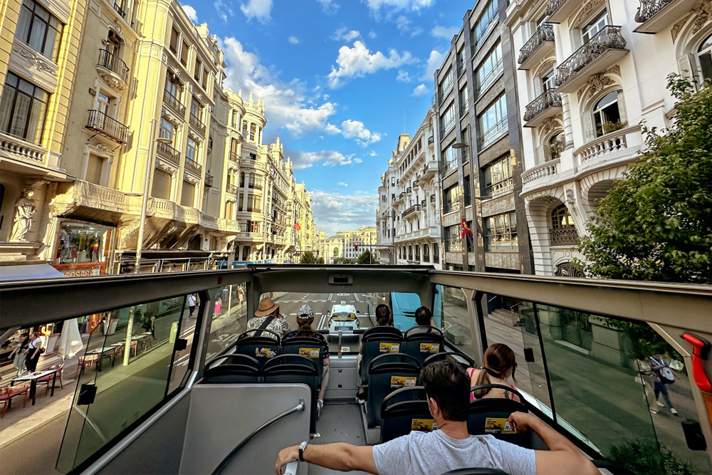 Big Bus Madrid Hop-on Hop-off Bus Tour - Explore Madrid with the Big Bus Hop-on Hop-off Tour. Enjoy unlimited rides on an open-top bus with stops at top attractions. Listen to live commentary and explore at your own pace. Choose a 24-hour or 48-hour pass for a flexible sightseeing experience. Big Bus Madrid Hop-on Hop-off Bus Tour - Image 1 of 5