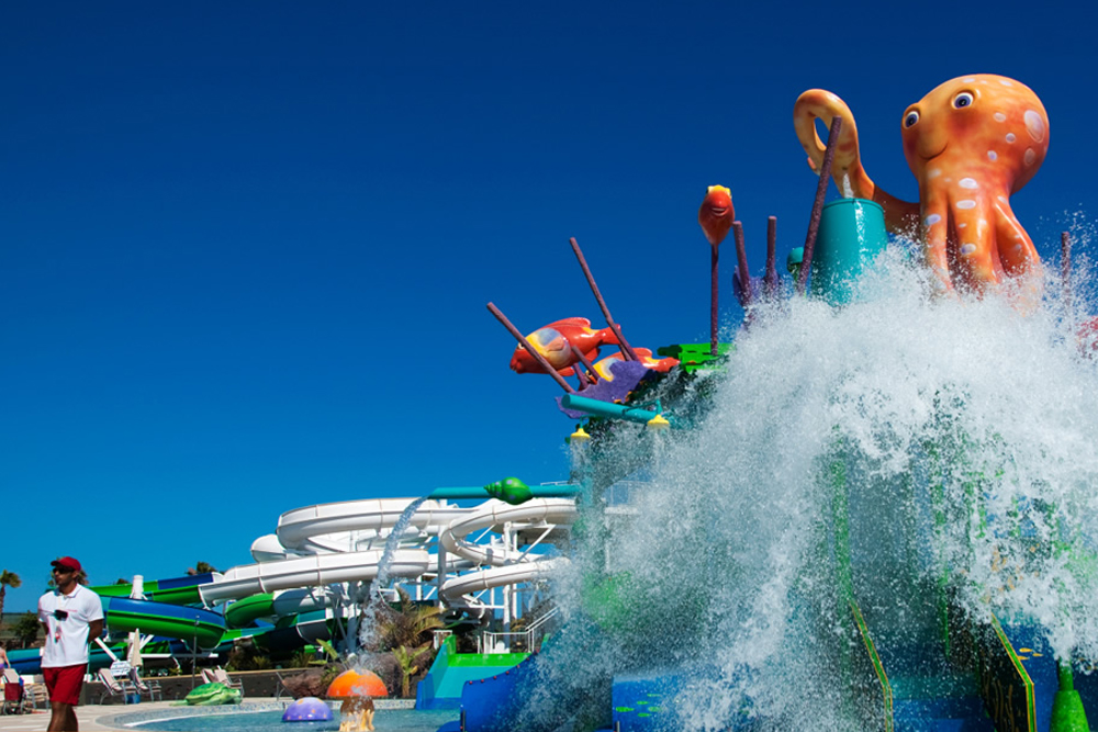 Aqualava Waterpark ticket in Lanzarote - Enjoy a thrilling day at Aqualava Waterpark in Lanzarote with exciting slides, a wave pool, and a lazy river. Relax in geothermal-heated pools and explore a fun-filled kids' area. Take in stunning volcanic views while enjoying top facilities. Book your Aqualava Waterpark ticket now for an unforgettable adventure. Aqualava Waterpark ticket in Lanzarote - Image 1 of 5
