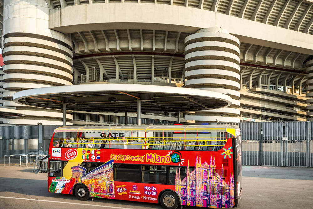City Sightseeing Milan Hop-on Hop-off Bus Tour - Discover Milan with the City Sightseeing Milan Hop-on Hop-off Bus Tour. Enjoy unlimited stops and explore top attractions like the Duomo, Sforza Castle, and Santa Maria delle Grazie. Experience the city's modern skyline and luxury shopping streets. Sports fans can visit San Siro Stadium and Casa Milan on Line C. Book your hop-on hop-off bus ticket for a flexible and scenic tour of Milan. City Sightseeing Milan Hop-on Hop-off Bus Tour - Image 1 of 5