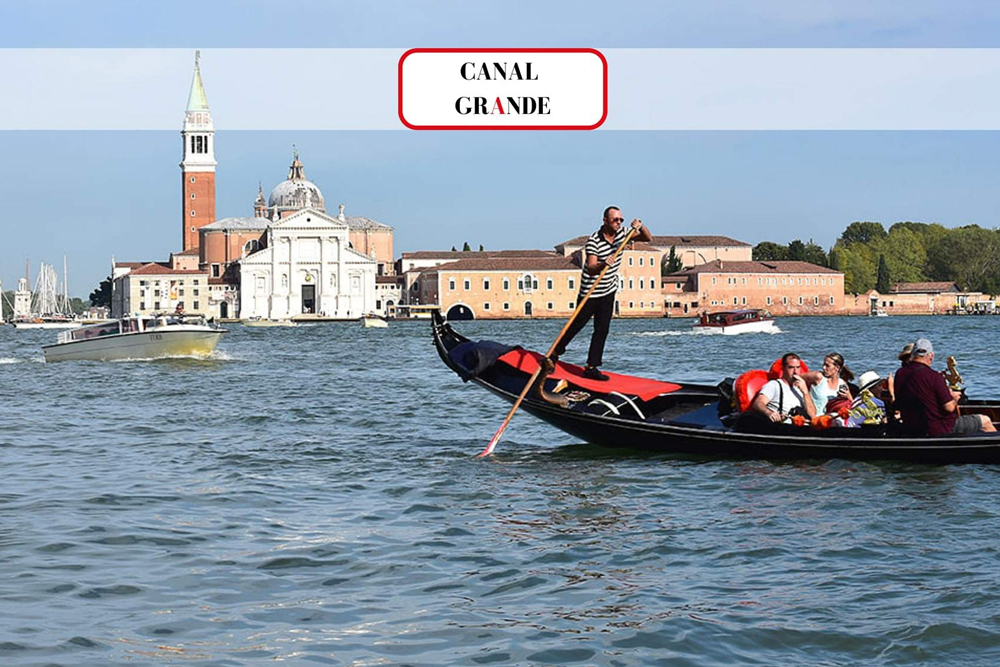 Grand Canal Romantic Gondola Ride in Venice - Enjoy a Grand Canal Romantic Gondola Ride in Venice and glide through historic waterways. Admire stunning palaces, charming bridges, and iconic landmarks from a traditional gondola. Experience the romance of Venice as your gondolier guides you through hidden canals. Book your gondola ride for an unforgettable Venetian adventure. Grand Canal Romantic Gondola Ride in Venice - Image 2 of 5