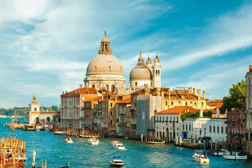 Grand Canal Romantic Gondola Ride in Venice - Enjoy a Grand Canal Romantic Gondola Ride in Venice and glide through historic waterways. Admire stunning palaces, charming bridges, and iconic landmarks from a traditional gondola. Experience the romance of Venice as your gondolier guides you through hidden canals. Book your gondola ride for an unforgettable Venetian adventure. Grand Canal Romantic Gondola Ride in Venice - Image 4 of 5