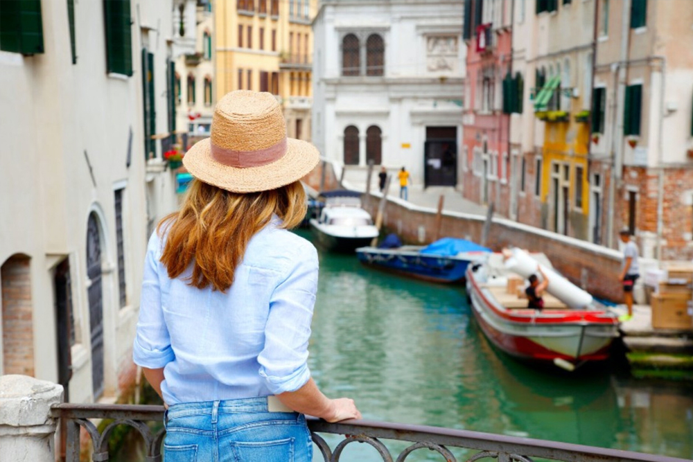 Grand Canal Romantic Gondola Ride in Venice - Enjoy a Grand Canal Romantic Gondola Ride in Venice and glide through historic waterways. Admire stunning palaces, charming bridges, and iconic landmarks from a traditional gondola. Experience the romance of Venice as your gondolier guides you through hidden canals. Book your gondola ride for an unforgettable Venetian adventure. Grand Canal Romantic Gondola Ride in Venice - Image 5 of 5