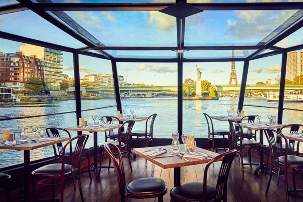 Lunch Cruise on the Seine River - Enjoy a Lunch Cruise on the Seine River and discover Paris from the water. This scenic Seine River cruise offers stunning views of famous landmarks like the Eiffel Tower and the Louvre. Savor a traditional three-course meal while cruising along the Seine River. A Seine River lunch cruise is the perfect way to experience Paris in a relaxed and unique way. Book your Lunch Cruise on the Seine River for an unforgettable Paris experience. Lunch Cruise on the Seine River - Image 3 of 5