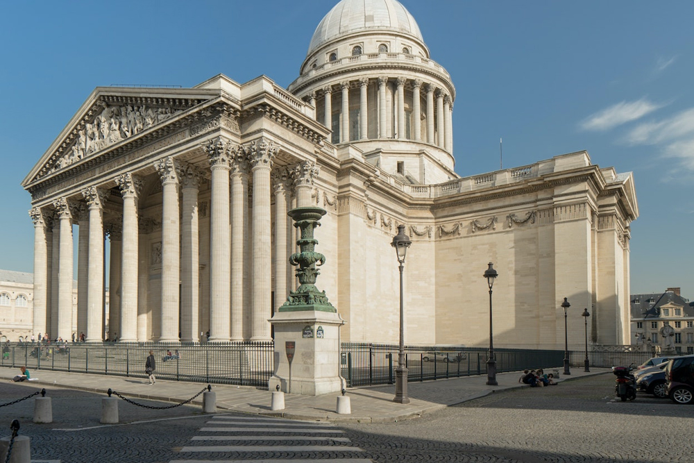 Pantheon in Paris - Visit the Pantheon in Paris, a stunning neoclassical monument located in the Latin Quarter. Explore its grand dome, beautiful canvas paintings, and the famous replica of Foucault’s Pendulum. Discover the crypt, where the tombs of iconic French figures like Voltaire, Victor Hugo, and Marie Curie are housed. Book your Pantheon Paris tickets online to experience this historical landmark. Pantheon in Paris - Image 1 of 5
