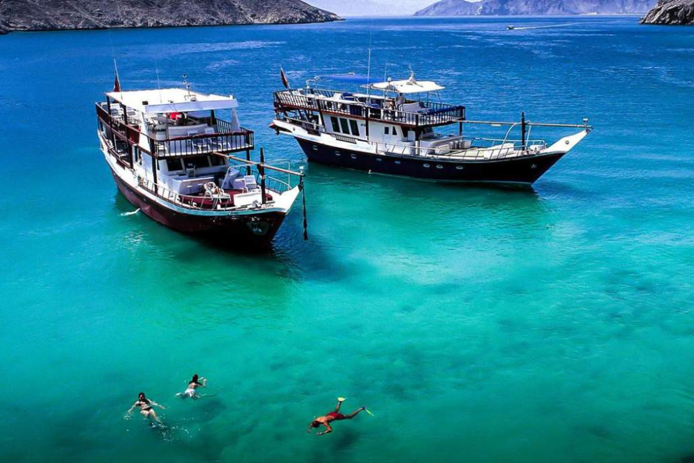 Musandam Dibba Cruise Tour with Lunch from Dubai - Explore the most beautiful landscape, Golden Sands, Hajar Mountain and some cruise ride in the crystal clear water. Musandam Tour from Dubai offers. Its jagged coastline features fjord-like inlets called khors, and its waters are home to dolphins and other marine life. The most popular activity in the peninsula is Dhow cruises. Musandam Dibba Cruise Tour with Lunch from Dubai - Image 1 of 5